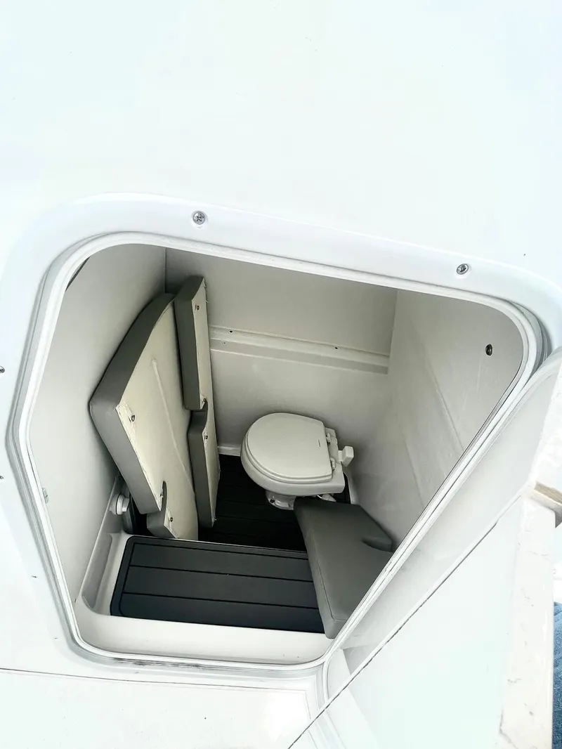 Slide: The Image of 2024 Cape Horn 32xs boat interior with compact marine toilet. - 11