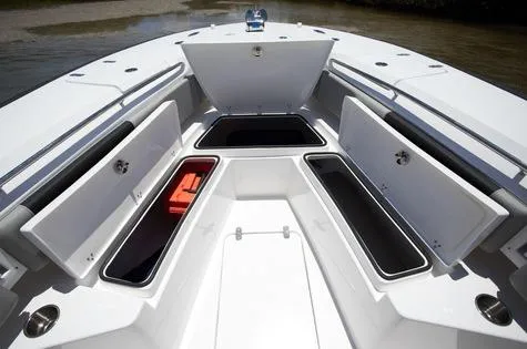 Slide: The Image of 2024 Cape Horn 32xs boat storage compartments open on deck. - 6