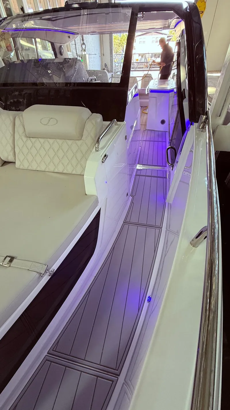 Slide: The Image of Luxury Schaefer 375 yacht interior with modern seating and ambient lighting, 2025 model. - 12