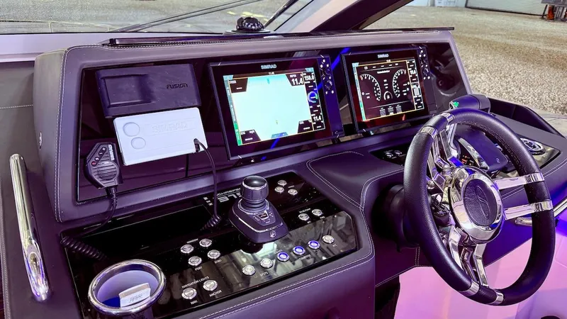 Slide: The Image of Schaefer 375 yacht helm with advanced navigation displays and controls, 2025 model. - 15