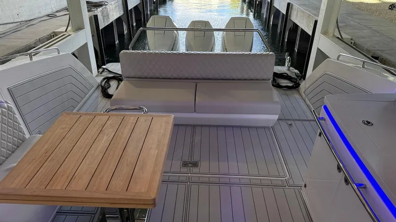 Slide: The Image of 2025 Schaefer 375 yacht interior with seating, table, and modern design. - 16