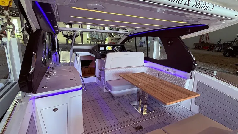 Slide: The Image of Luxurious interior of 2025 Schaefer 375 yacht with modern seating and ambient lighting. - 17