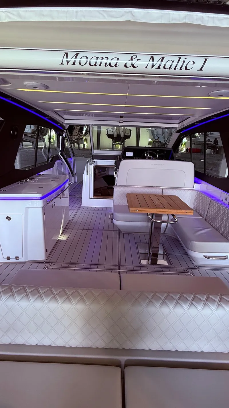 Slide: The Image of Luxurious 2025 Schaefer 375 yacht interior with elegant seating and ambient lighting. - 18