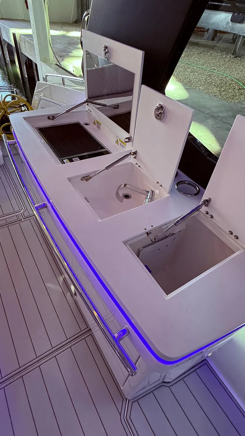 Slide: The Image of Schaefer 375 yacht kitchen area with modern amenities, 2025 model. - 20