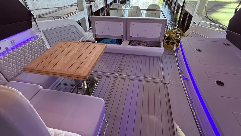 Slide: The Image of Luxurious Schaefer 375 yacht interior with seating, table, and storage, 2025 model. - 22