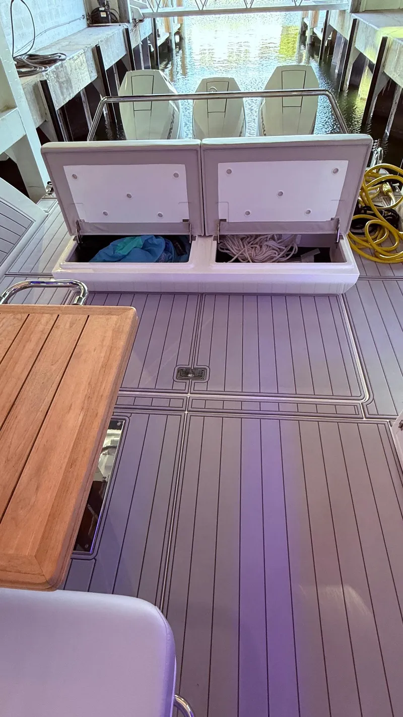 Slide: The Image of Schaefer 375 yacht deck with storage compartments, 2025 model. - 23