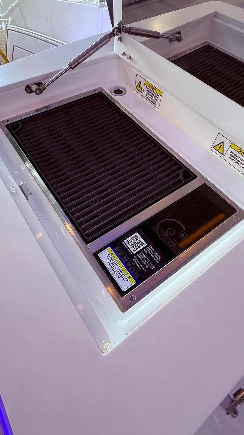 Slide: The Image of Schaefer 375 yacht grill area, 2025 model, featuring a sleek, modern design. - 25