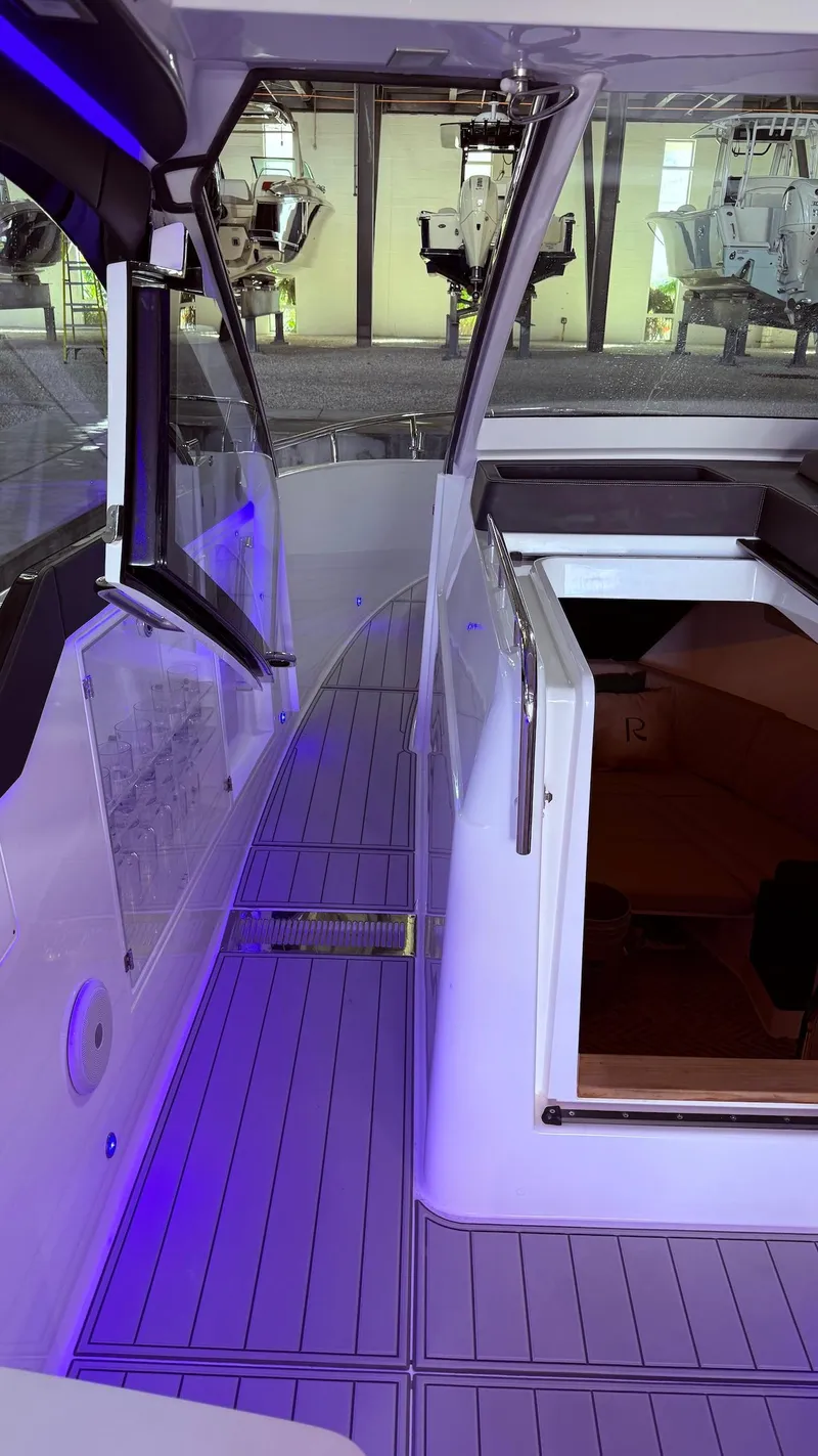 Slide: The Image of 2025 Schaefer 375 yacht interior with modern design and ambient lighting. - 28