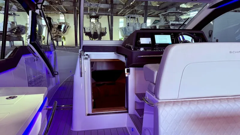 Slide: The Image of Interior of 2025 Schaefer 375 yacht with modern helm and luxurious seating. - 29