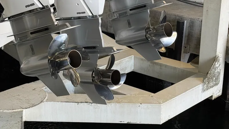 Slide: The Image of Schaefer 375 boat propellers, 2025 model, in a dock setting. - 3