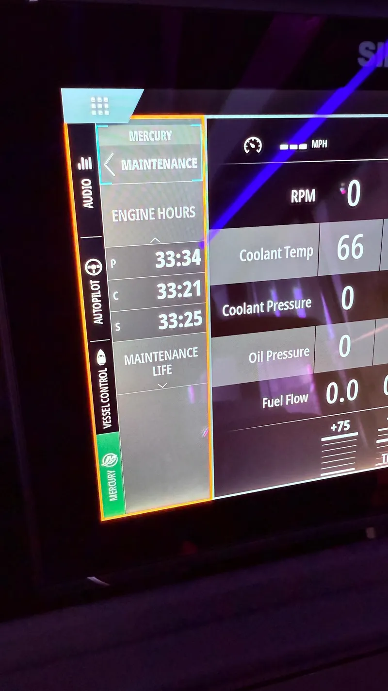 Slide: The Image of Schaefer 375 boat dashboard displaying engine maintenance data and performance metrics, 2025 model. - 31