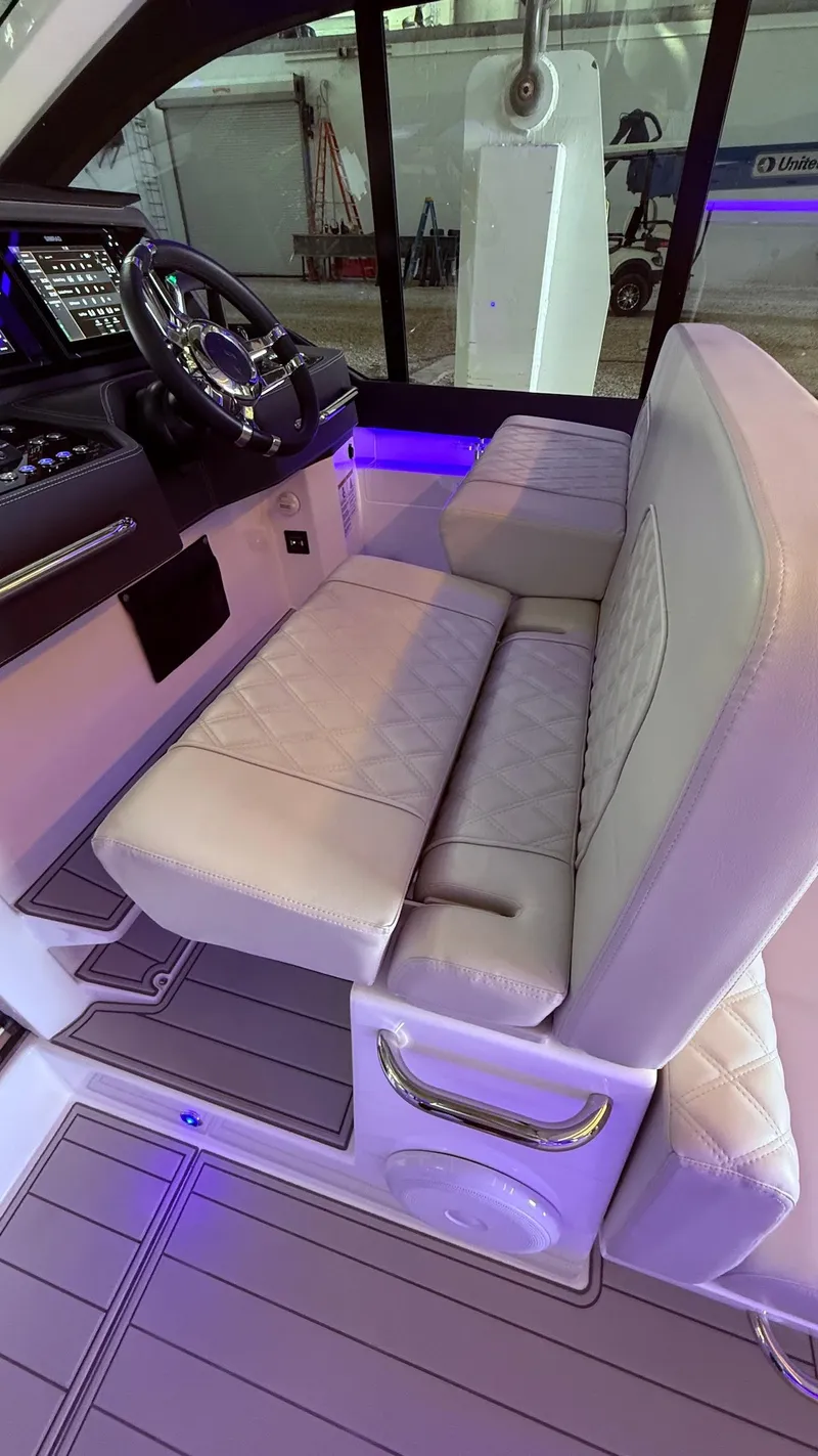 Slide: The Image of Luxurious interior of 2025 Schaefer 375 yacht with plush seating and modern dashboard. - 32