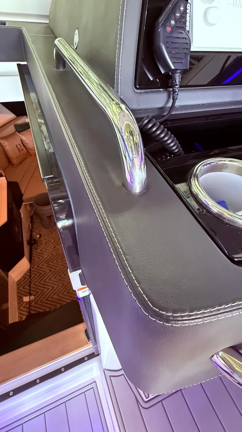 Slide: The Image of Interior of 2025 Schaefer 375 yacht, featuring sleek leather and chrome details. - 34