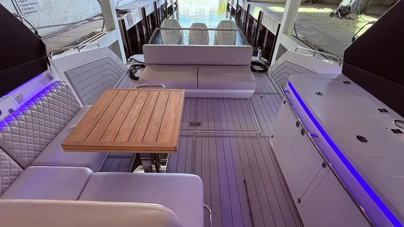 Slide: The Image of Luxurious 2025 Schaefer 375 yacht interior with elegant seating and wooden table. - 35