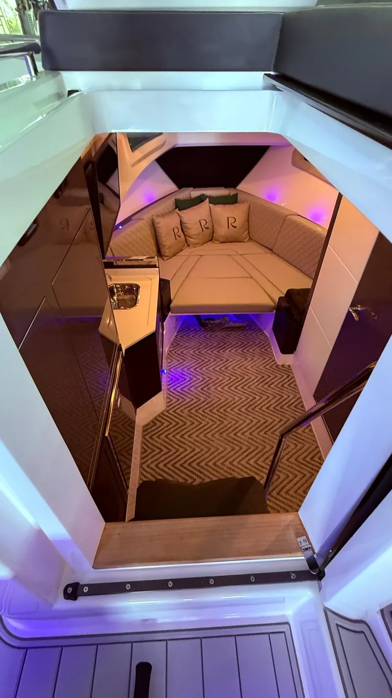 Slide: The Image of Luxurious interior of 2025 Schaefer 375 yacht with cozy seating and ambient lighting. - 36