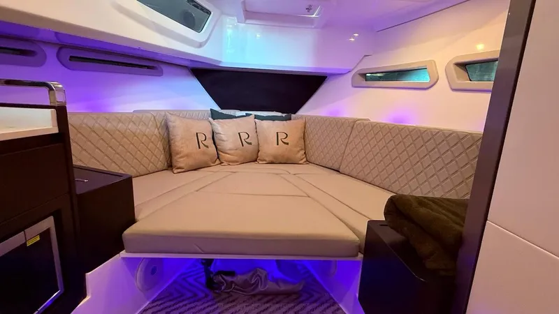 Slide: The Image of Luxurious interior of 2025 Schaefer 375 yacht with plush seating and ambient lighting. - 39