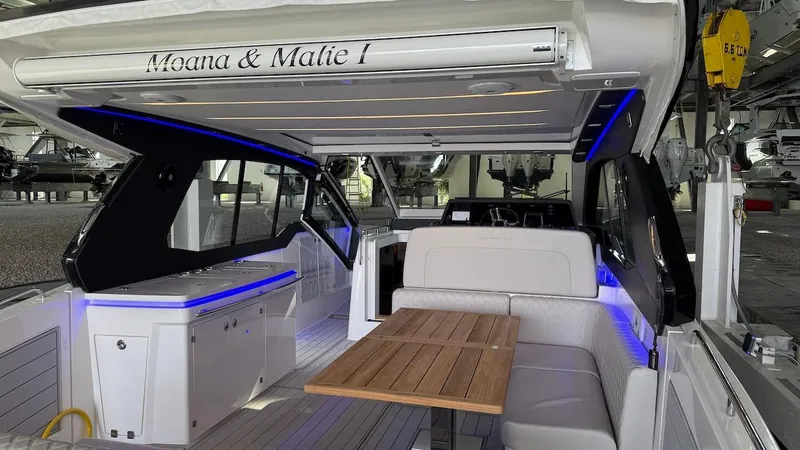 Slide: The Image of Luxurious 2025 Schaefer 375 yacht interior with elegant seating and wooden table. - 4