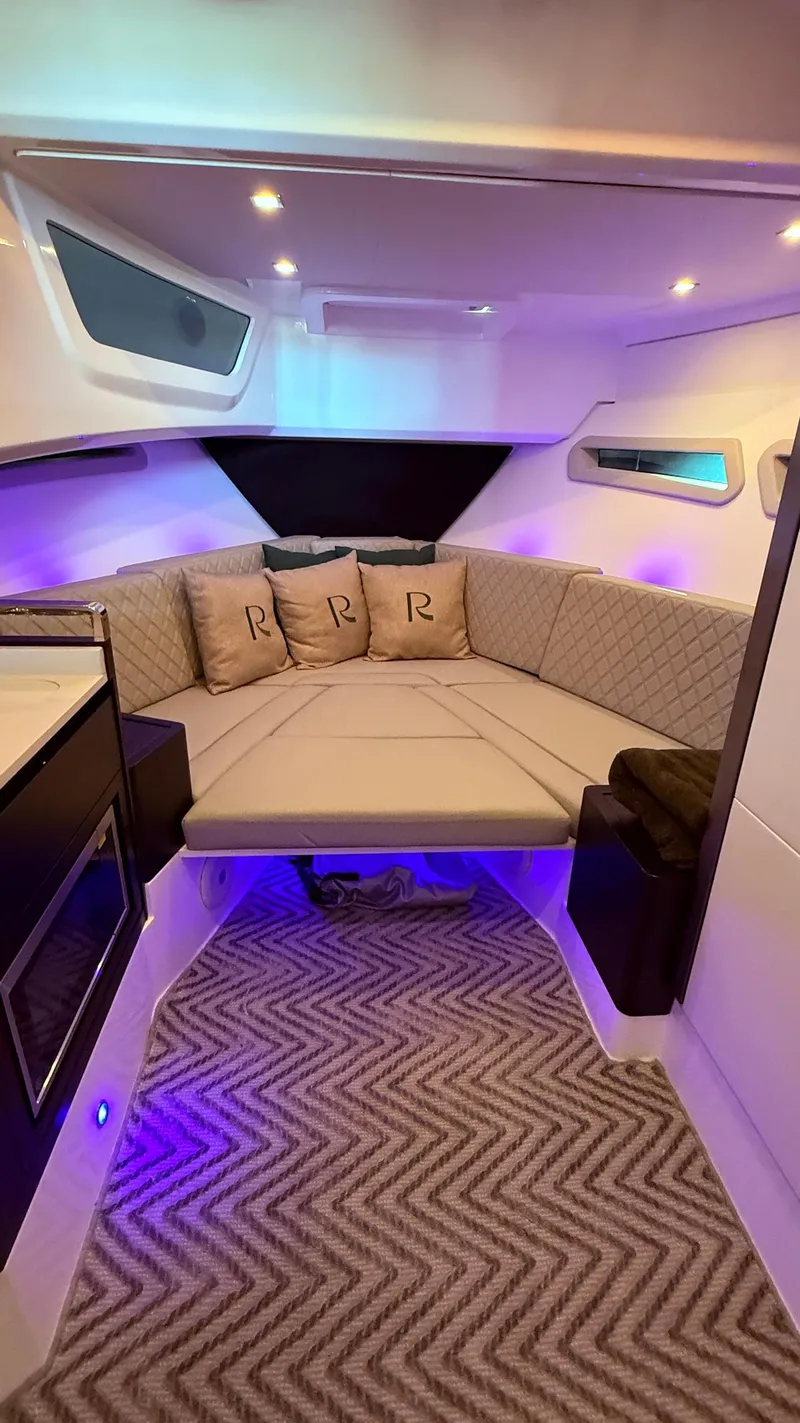 Slide: The Image of Luxurious interior of 2025 Schaefer 375 yacht with plush seating and ambient lighting. - 40