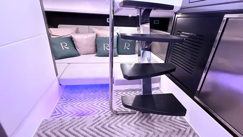 Slide: The Image of Luxurious interior of 2025 Schaefer 375 yacht with modern staircase and cozy seating area. - 44