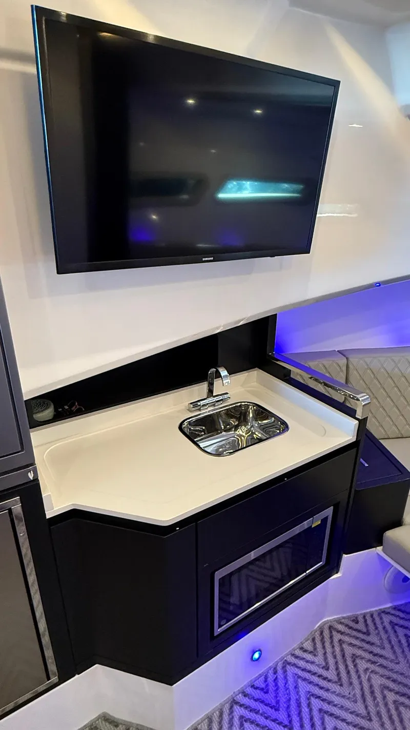 Slide: The Image of Modern Schaefer 375 yacht interior with TV, sink, and ambient lighting, 2025 model. - 47