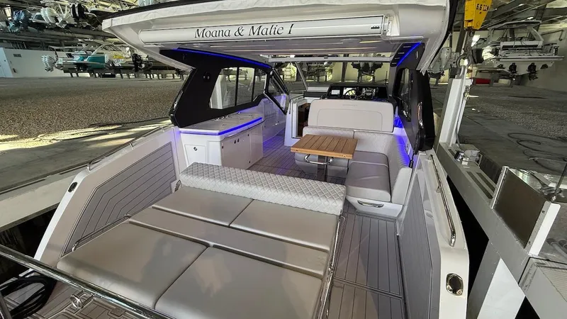 Slide: The Image of Luxurious 2025 Schaefer 375 yacht interior with modern seating and ambient lighting. - 6