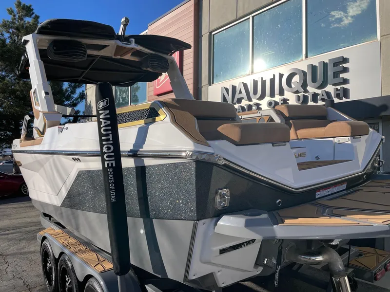 Slide: The Image of 2024 Nautique Super Air Nautique G25 Paragon boat displayed at dealership. - 3