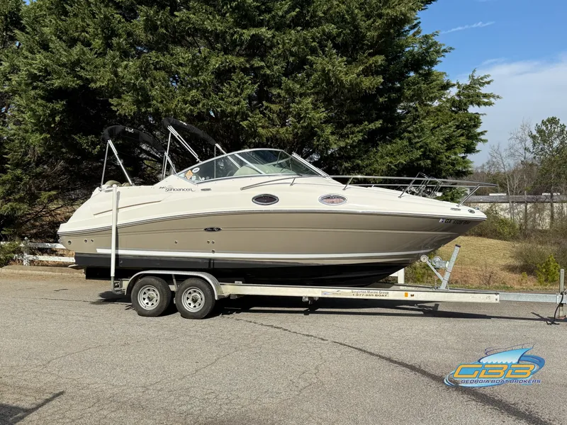Slide: The Image of 2007 Sea Ray 240 Sundancer boat on trailer, parked outdoors. - 3
