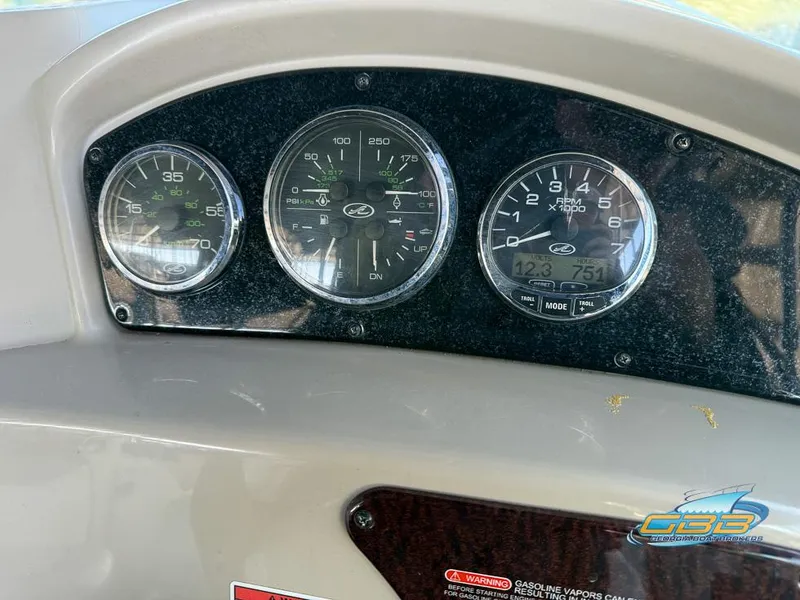 Slide: The Image of Dashboard gauges of a 2007 Sea Ray 240 Sundancer boat. - 33
