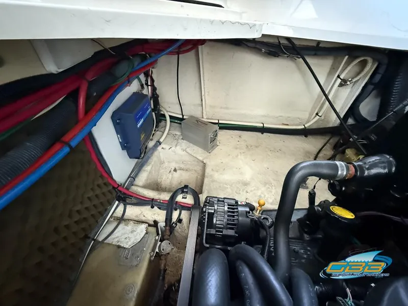 Slide: The Image of Engine compartment of a 2007 Sea Ray 240 Sundancer with visible wiring and components. - 35