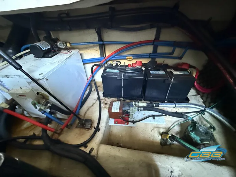 Slide: The Image of Engine compartment of 2007 Sea Ray 240 Sundancer with batteries and wiring. - 36