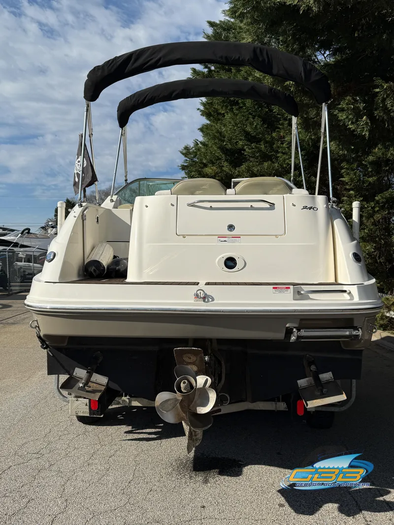 Slide: The Image of 2007 Sea Ray 240 Sundancer boat, rear view, parked outdoors. - 37