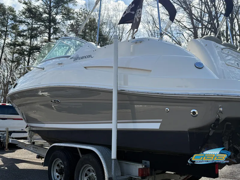 Slide: The Image of 2007 Sea Ray 240 Sundancer boat on trailer, side view, outdoors. - 39