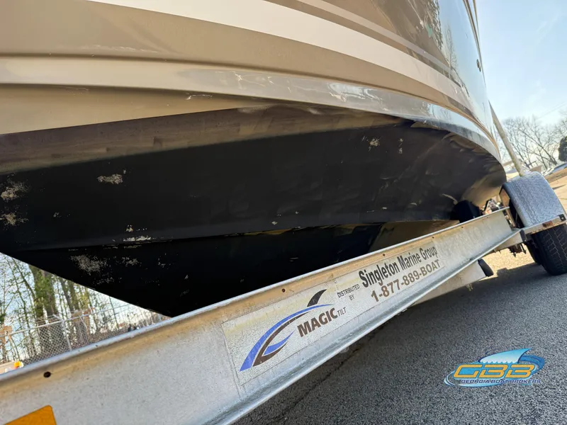 Slide: The Image of 2007 Sea Ray 240 Sundancer on trailer, close-up view of hull and trailer branding. - 41