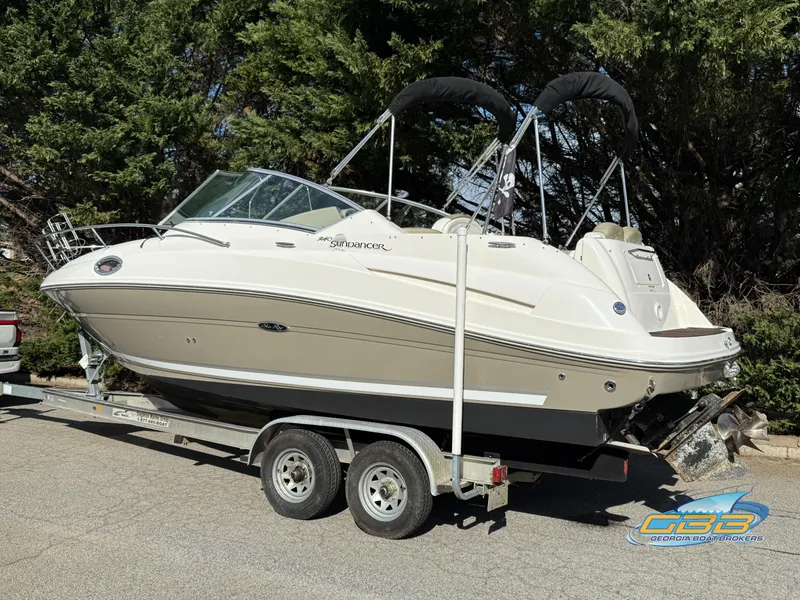 Slide: The Image of 2007 Sea Ray 240 Sundancer boat on trailer, parked outdoors. - 5
