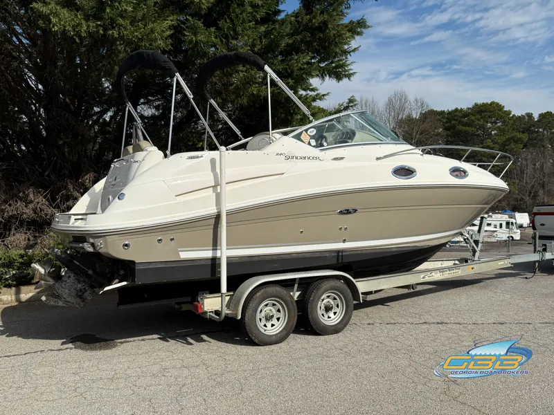 Slide: The Image of 2007 Sea Ray 240 Sundancer boat on trailer, parked outdoors. - 6