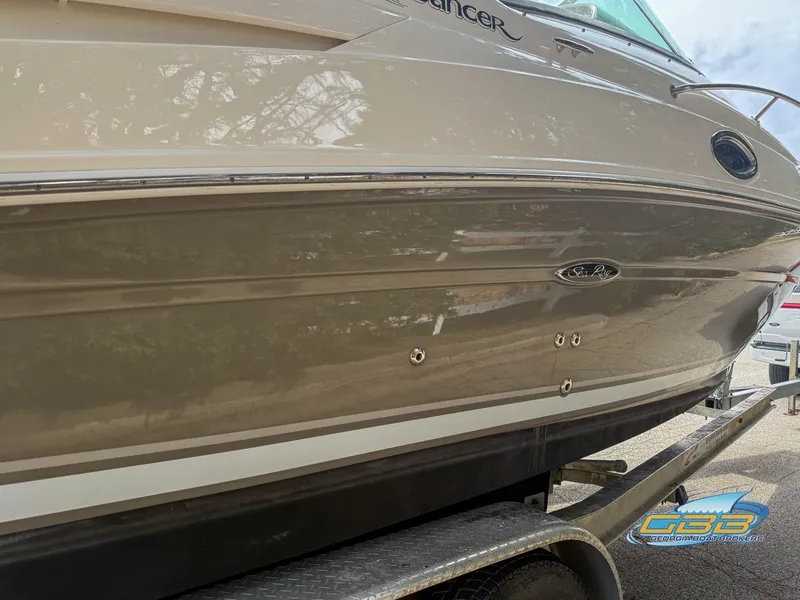 Slide: The Image of 2007 Sea Ray 240 Sundancer boat on trailer, side view, beige hull. - 8
