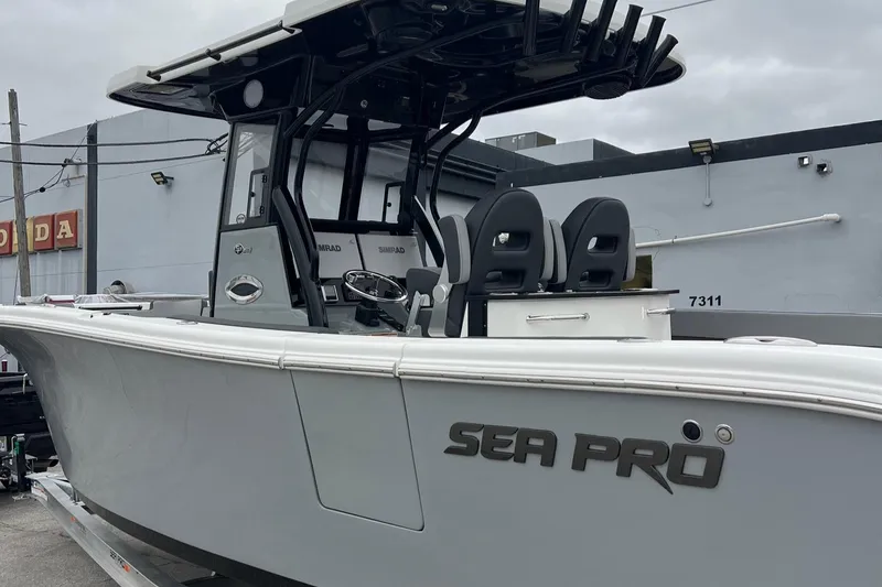 Slide: The Image of 2025 Sea Pro 292 boat with sleek design and modern features, docked outdoors. - 1