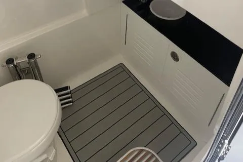 Slide: The Image of 2025 Sea Pro 292 boat bathroom with toilet and sink. - 10