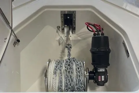 Slide: The Image of 2025 Sea Pro 292 boat anchor compartment with chain and winch system. - 11