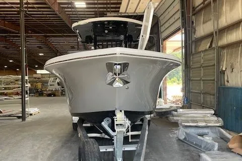 Slide: The Image of 2025 Sea Pro 292 boat in a warehouse, front view on trailer. - 3