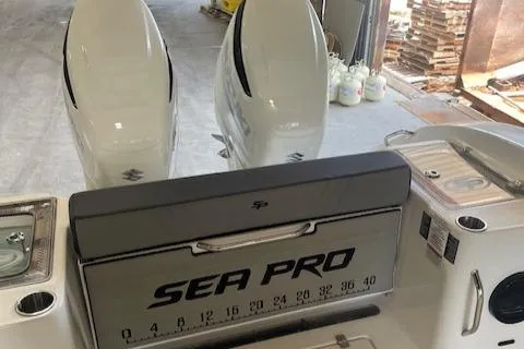 Slide: The Image of 2025 Sea Pro 292 boat with dual engines in a workshop setting. - 7