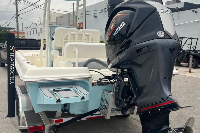 Slide: The Image of 2025 ShearWater 23LTZ boat with Yamaha 250 engine on trailer. - 7