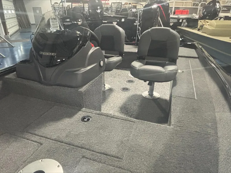 Slide: The Image of 2025 Tracker SG V16 SC boat interior with two seats and steering console. - 3