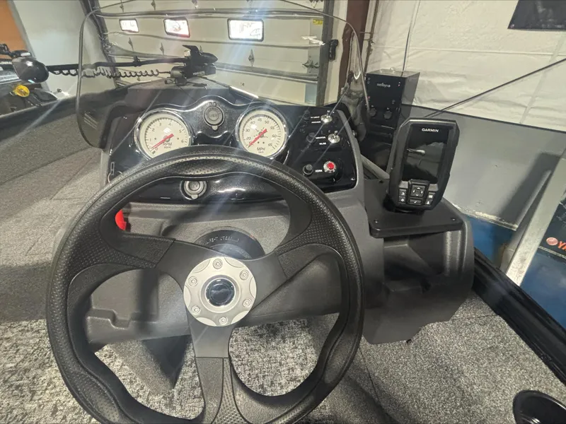 Slide: The Image of 2025 Tracker SG V16 SC boat dashboard with steering wheel and gauges. - 4