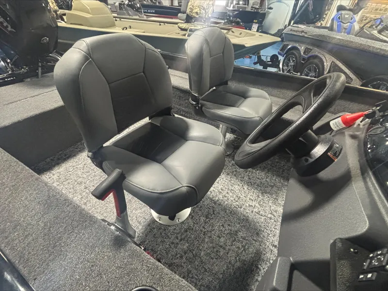 Slide: The Image of Interior of 2025 Tracker SG V16 SC boat with two seats and steering wheel. - 5