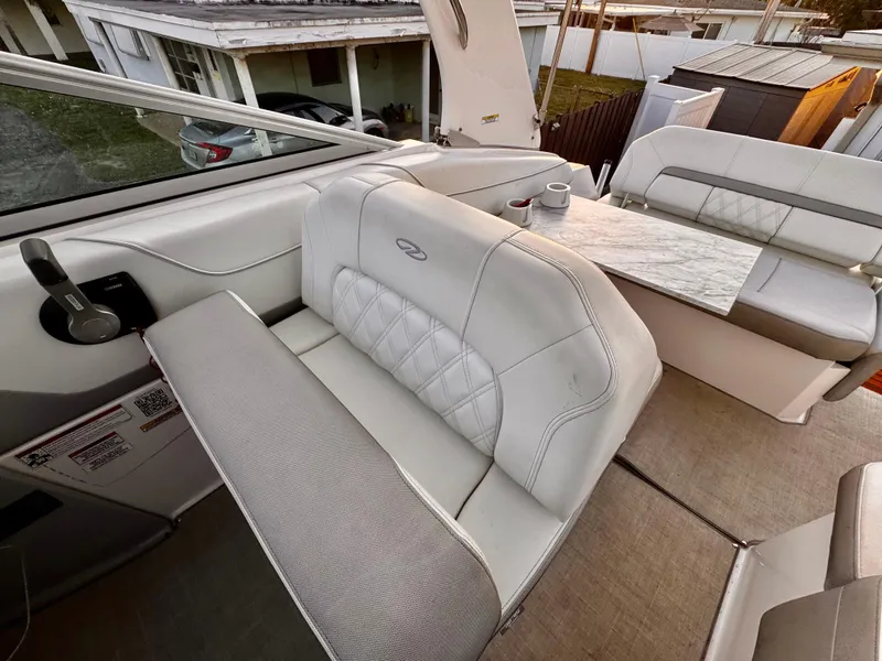 Slide: The Image of 2020 Regal 26XO boat interior with white leather seating and modern design. - 18