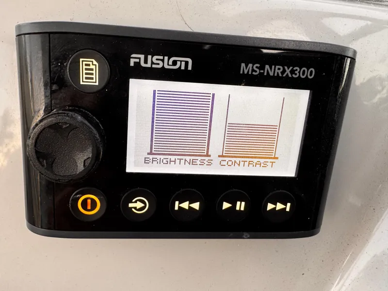 Slide: The Image of Fusion MS-NRX300 display on 2020 Regal 26XO, showing brightness and contrast settings. - 37