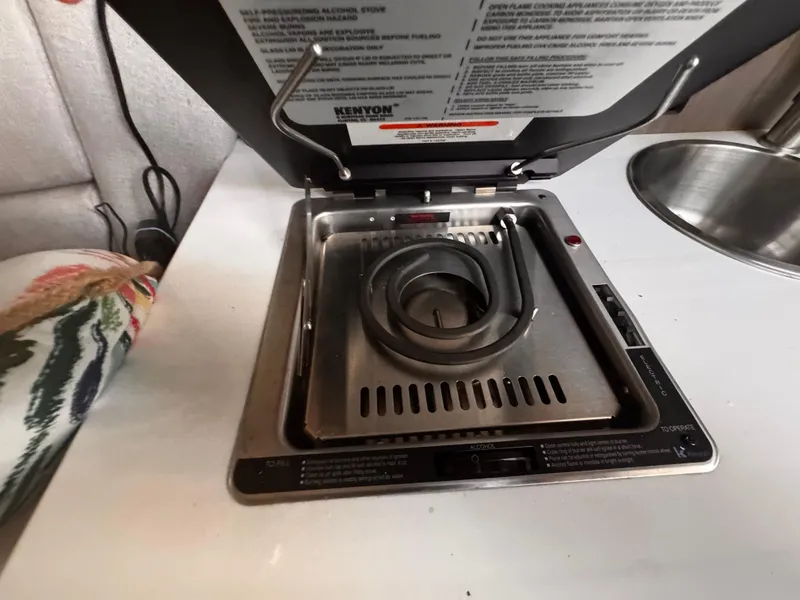 Slide: The Image of Kenyon electric stove in 2020 Regal 26XO boat kitchen. - 47