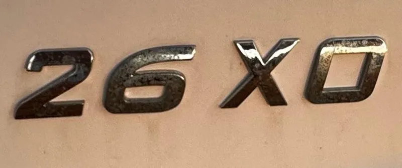 Slide: The Image of 2020 Regal 26XO model emblem on a beige surface. - 71