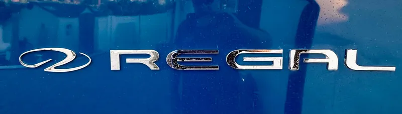 Slide: The Image of 2020 Regal 26XO logo on blue surface. - 78